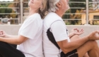 happy old couple doing yoga